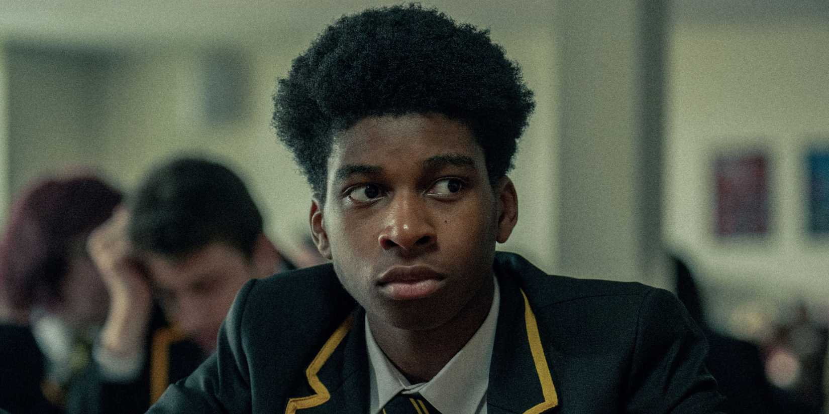 Amari Bacchus as Adam looking worried in Adolescence