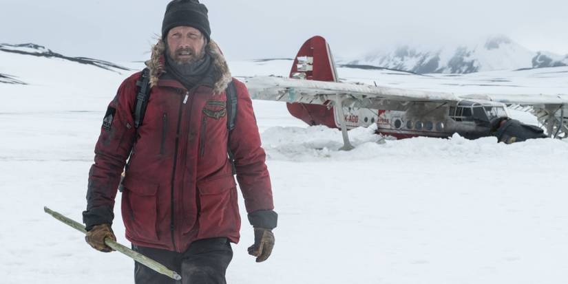 Mads Mikkelsen walking in the snow in Arctic