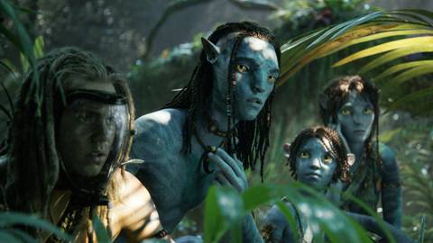 Spider, Lo'ak, Tuk, and Kiri in the forest in Avatar: Fire and Ash