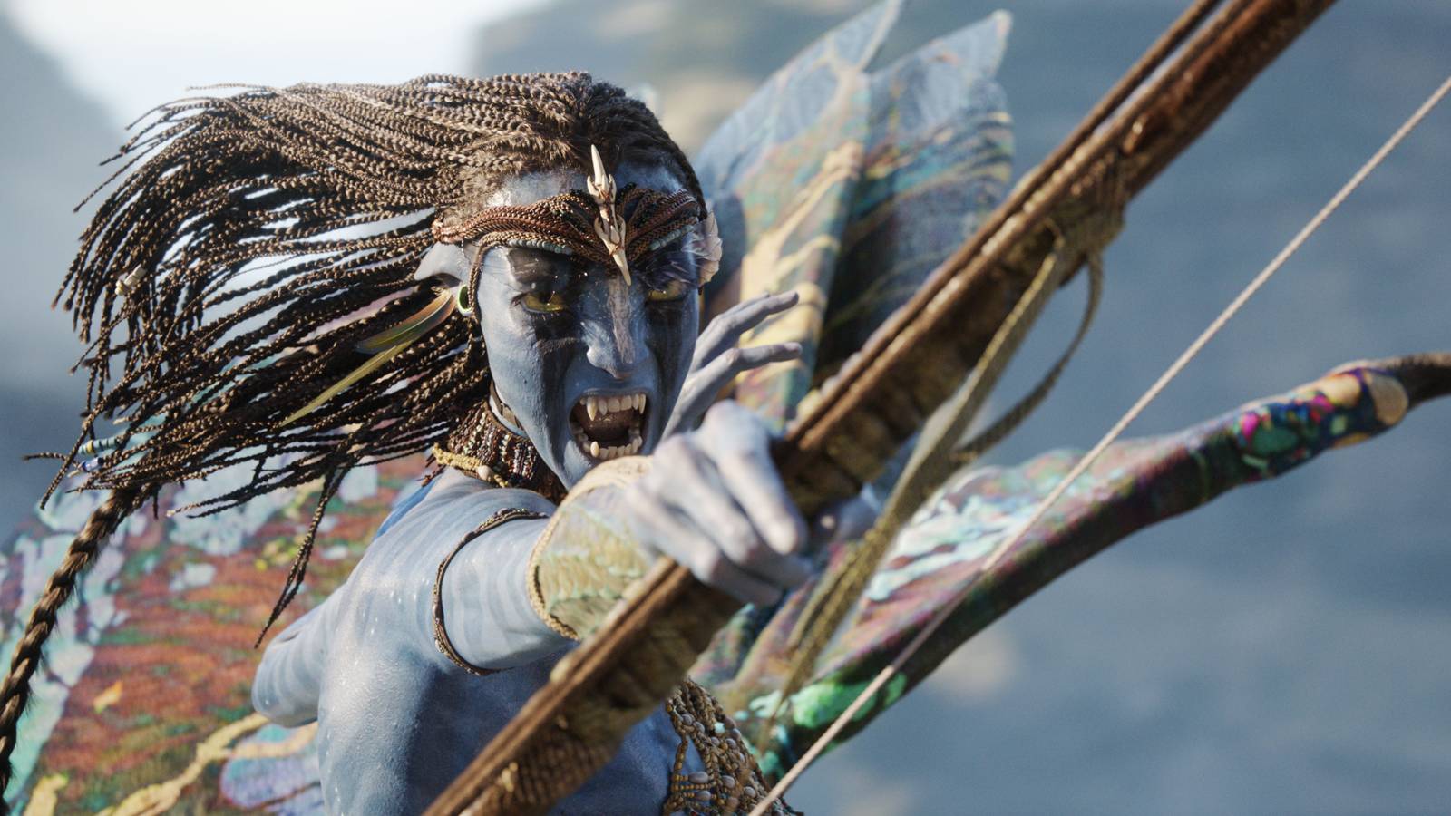 Neytiri (Zoe Saldaña shooting a bow and arrow while flying in Avatar: Fire and Ash