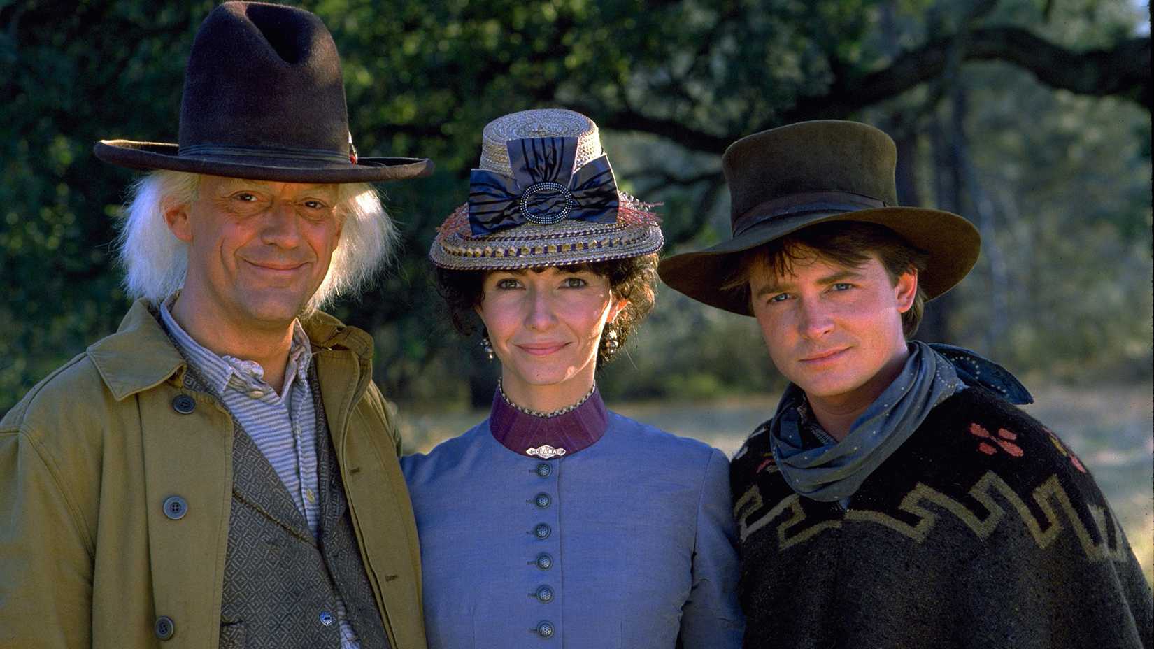 Marty, Doc, and Clara posing for a picture in Back to the Future Part 3