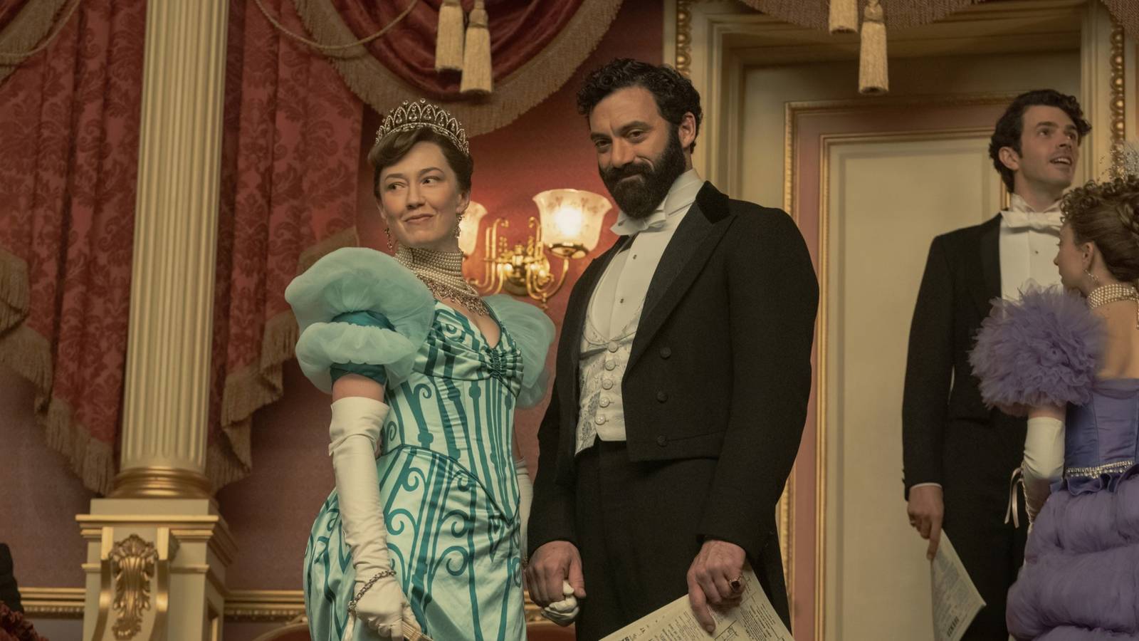 Bertha (Carrie Coon) and George Russell (Morgan Spector) smiling triumphantly in The Gilded Age season 2-1