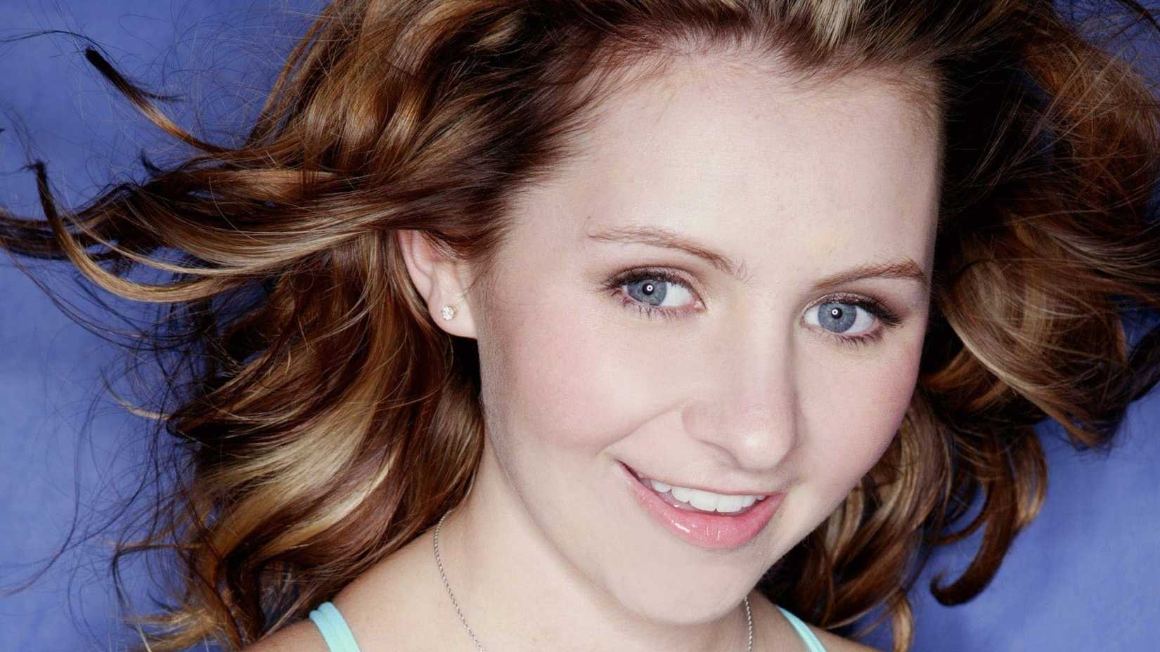 Beverley Mitchell smiling in headshot