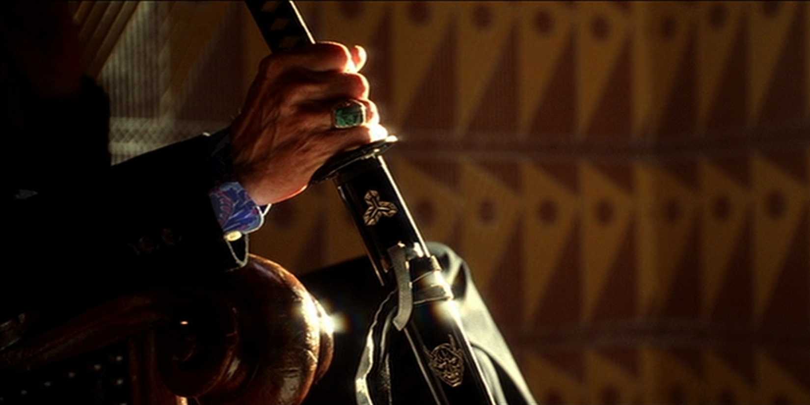 bill holding his sword in kill bill