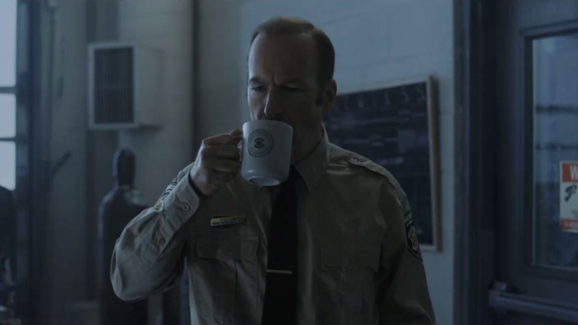 Bob Odenkirk sipping on a coffee in Normal
