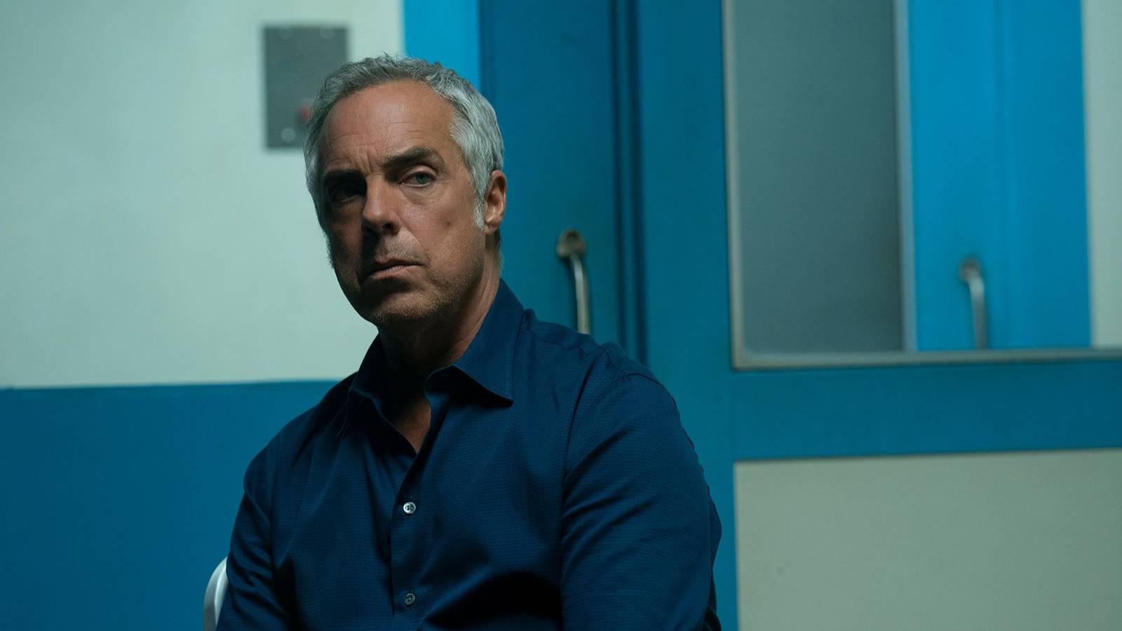 Harry Bosch (Titus Welliver) looking angry in an interrogation room in Bosch.