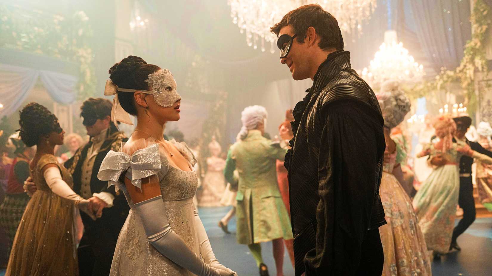 Bridgerton still featuring Luke Thompson as Benedict Bridgerton and Yerin Ha as Sophie Baek in masquerade garb.