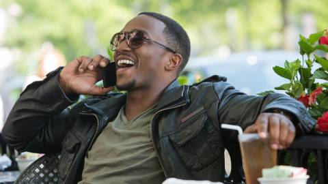 Sam Wilson (Anthony Mackie) laughing on the phone in Captain America: The Winter Soldier.