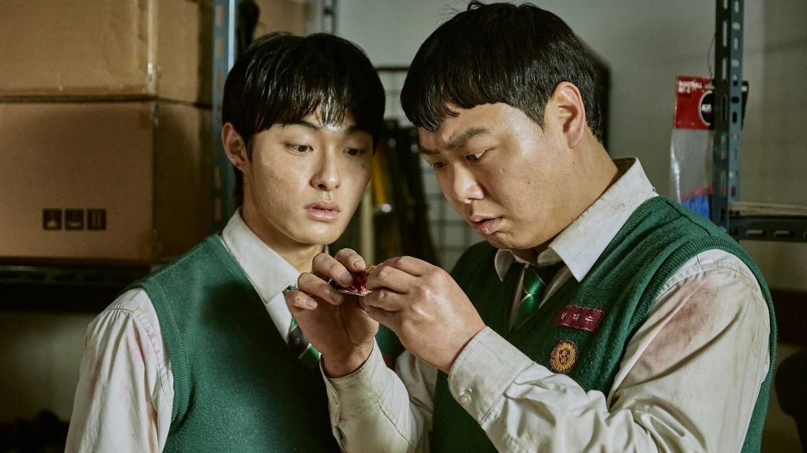 Cheong-san and Dae-su standing in a storage room in All of Us Are Dead.