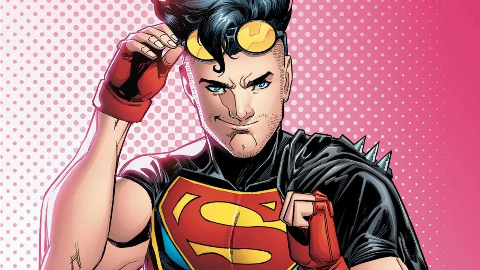 Conner Kent, aka Superboy, smirking and lifting his sunglasses to show off his blue eyes.