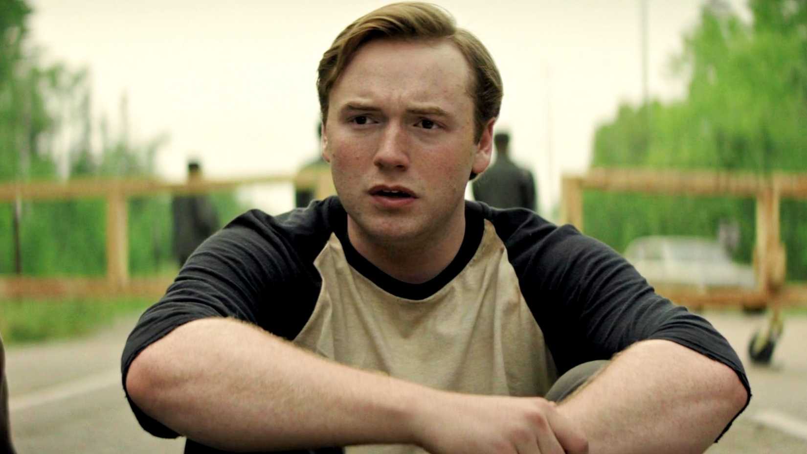 cooper hoffman sitting down in the long walk