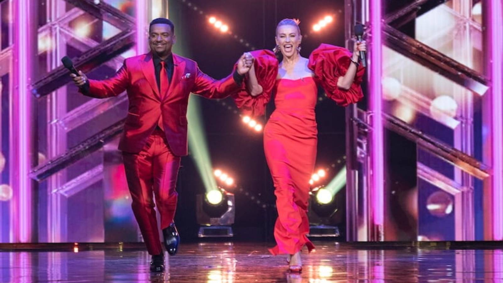 Dancing With The Stars Hosts Alfonso Ribeiro and Julianne Hough Wearing Matching Red Outfits Walking Out On Stage