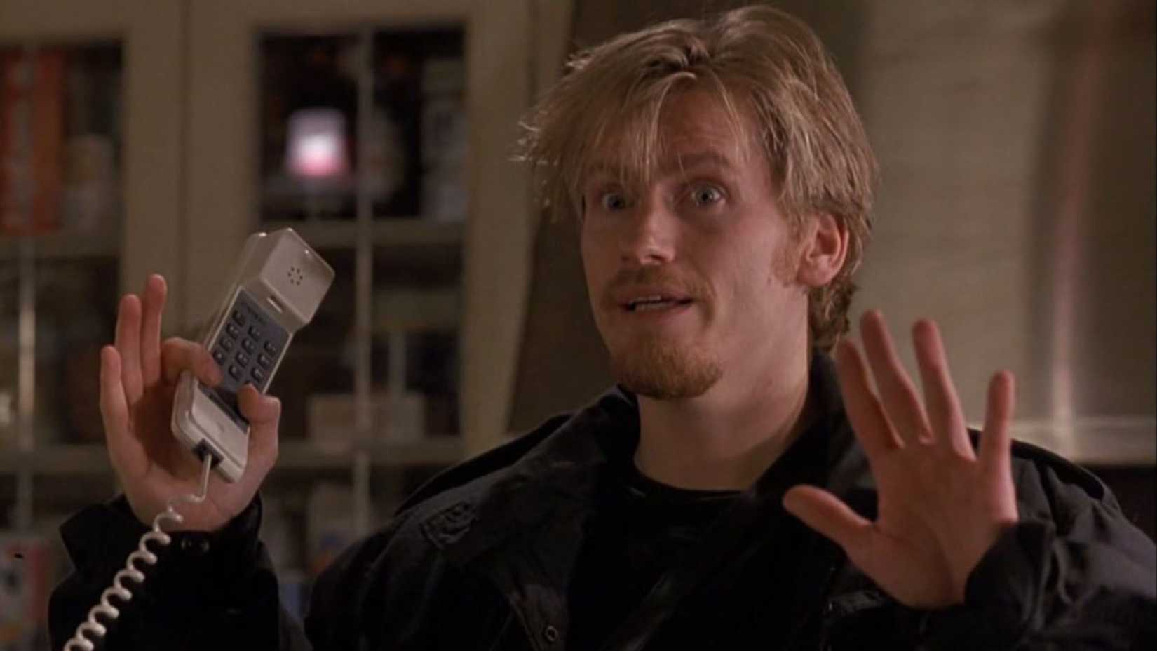 Denis Leary as Gus on the phone in The Ref