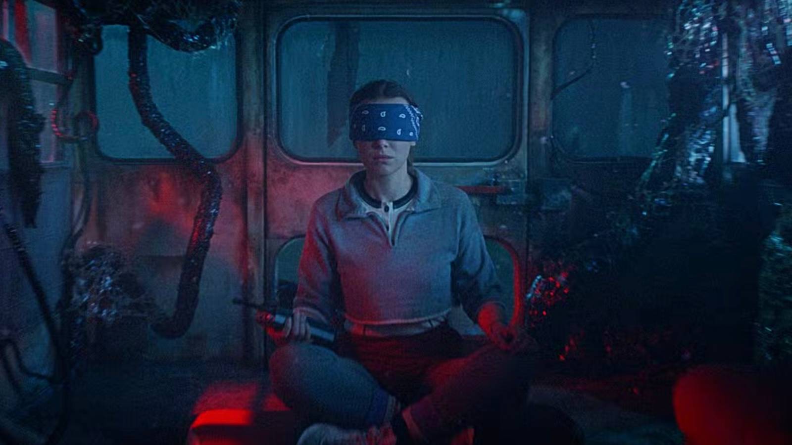 Eleven sits blindfolded in a van in the Upside Down from Stranger Things 5