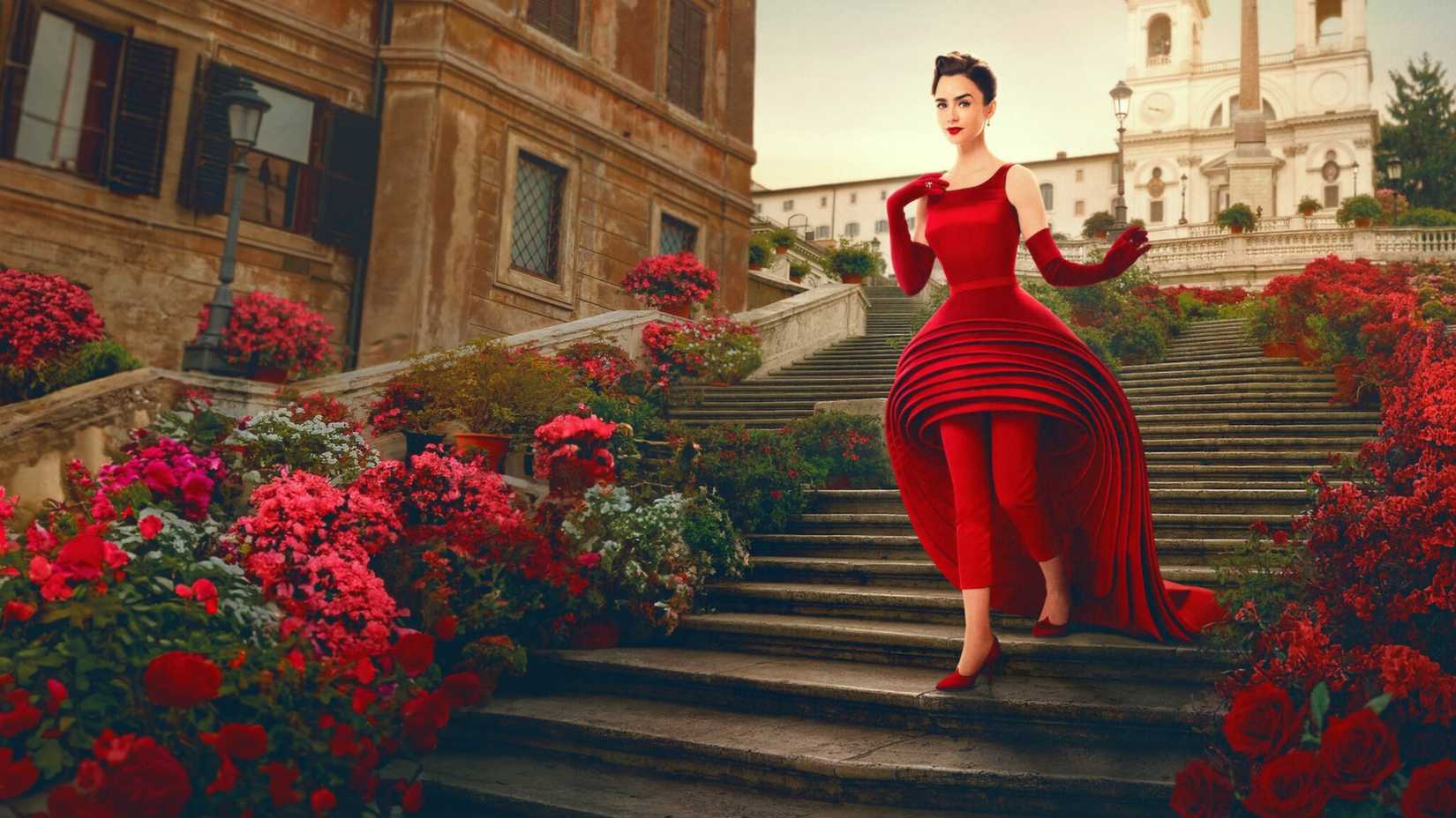 Emily Cooper (Lily Collins) descending steps in Rome in a red outfit in Emily in Paris season 5
