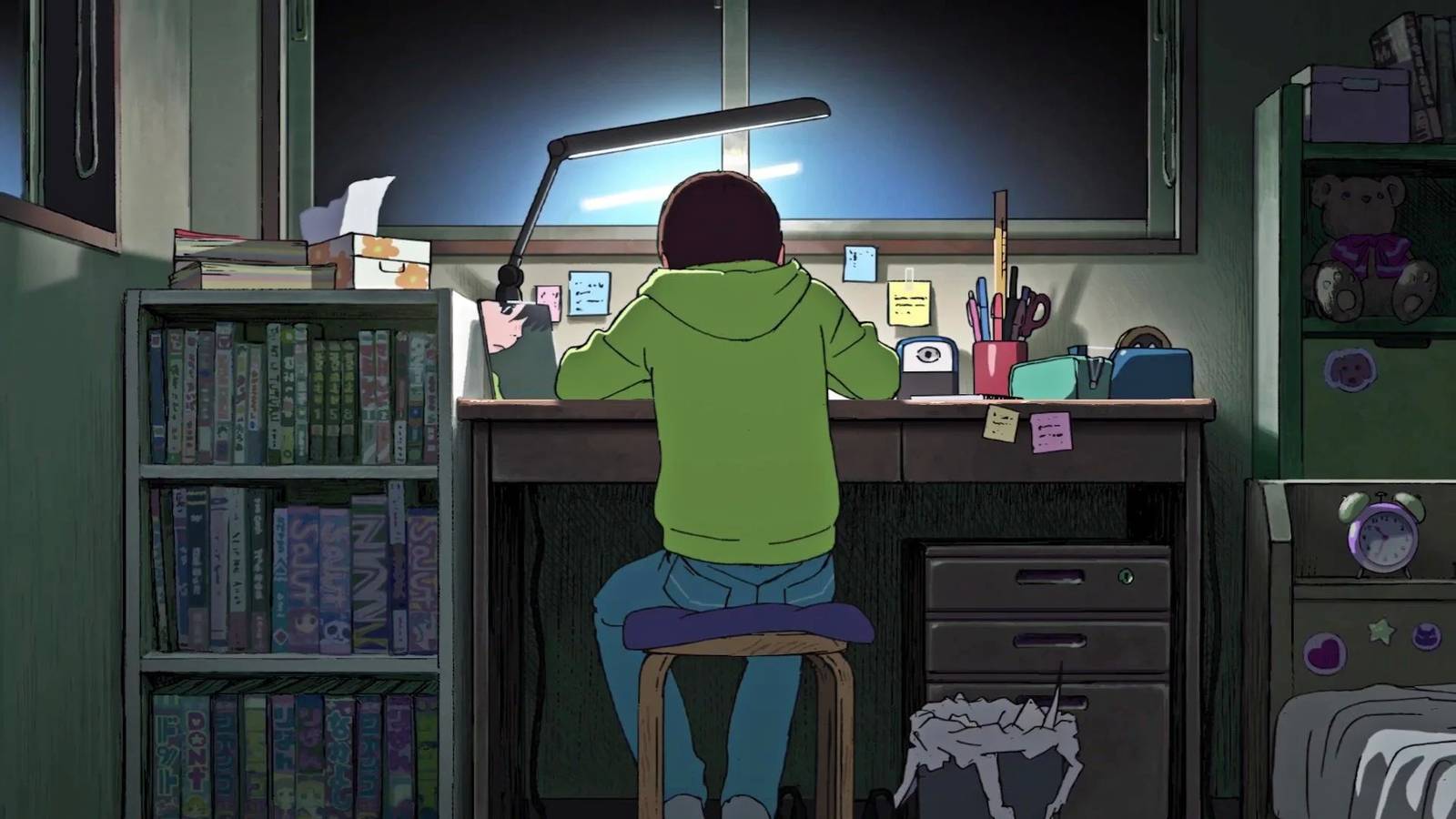 Fujino sitting at her desk and drawing in Look Back.