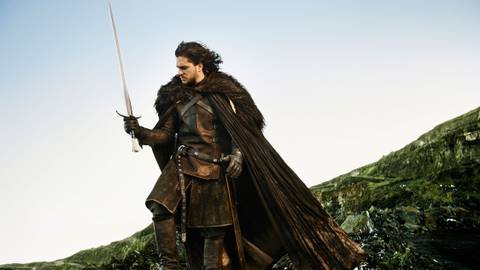 Kit Harington as Jon Snow holding a sword in Game of Thrones season 5