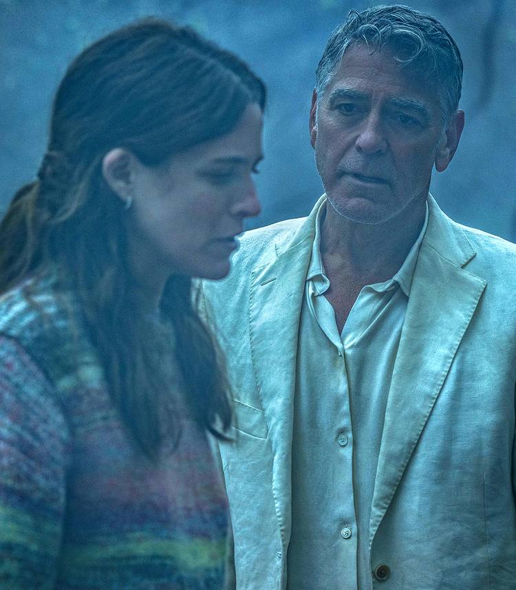 george clooney s jay looking sadly at riley keough s jessica in jay kelly