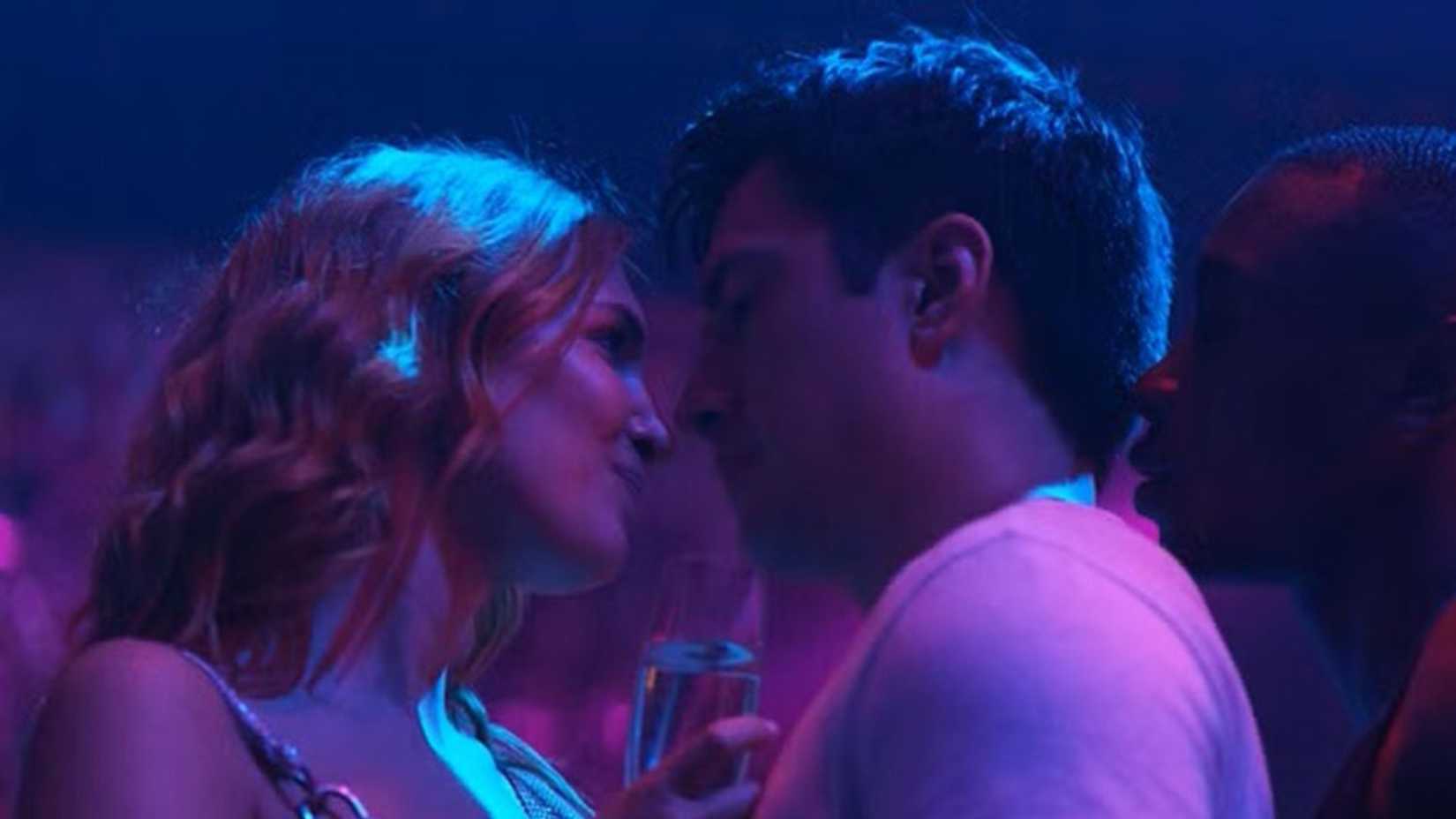 Rose, Shane, and Miles dancing together at a club in Heated Rivalry.