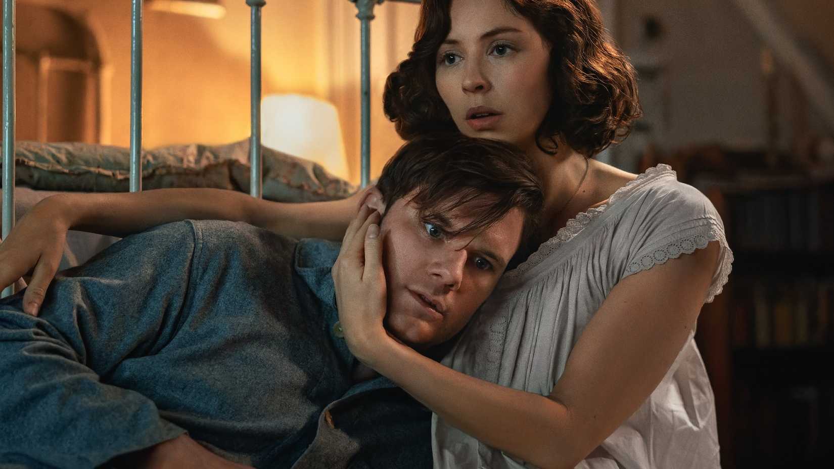 Henry (Jeremy Irvine) and Julia (Hermione Corfield) holding one another in Outlander Blood of my Blood