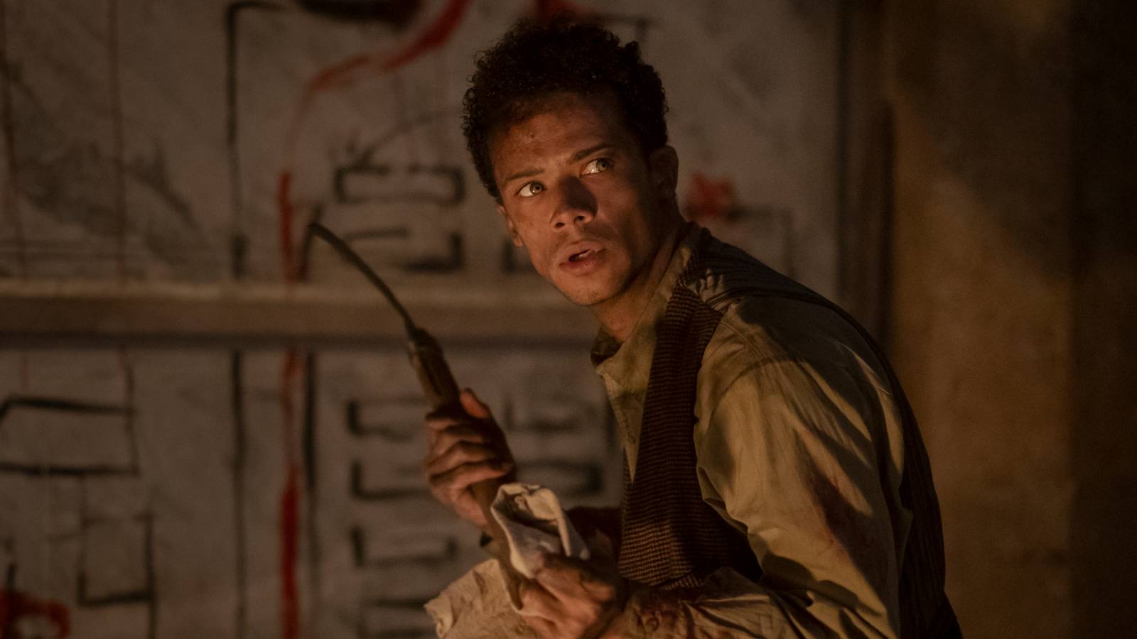 Jacob Anderson as Louis looking over his shoulder scared in Interview with the Vampire season 2