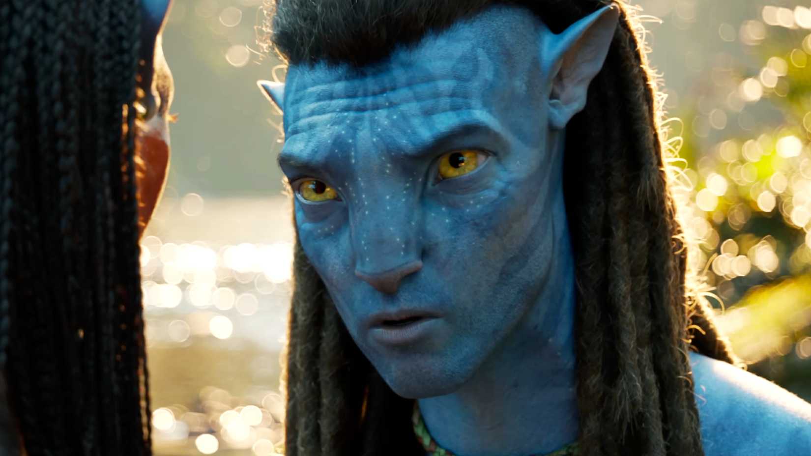 Sam Worthington looking concerned as Jake Sully in Avatar Fire and Ash