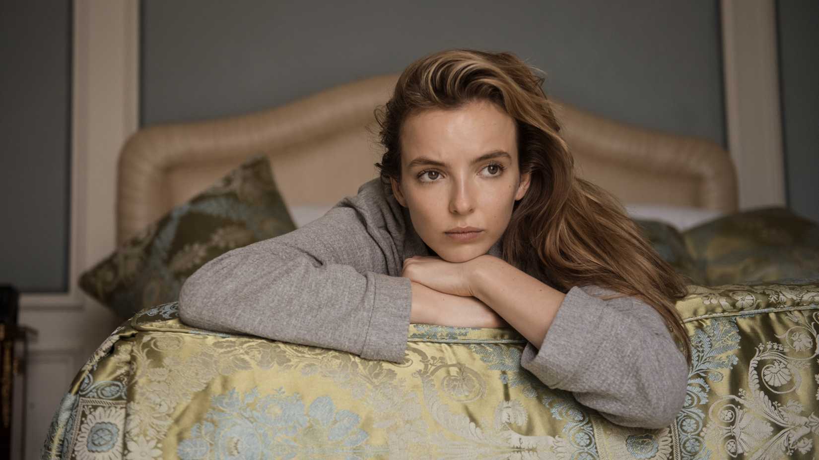 13 Female Characters Who Redefined Strength On TV 8 Jodie Comer as Villanelle lying down on a bed in thought in Killing Eve season 2