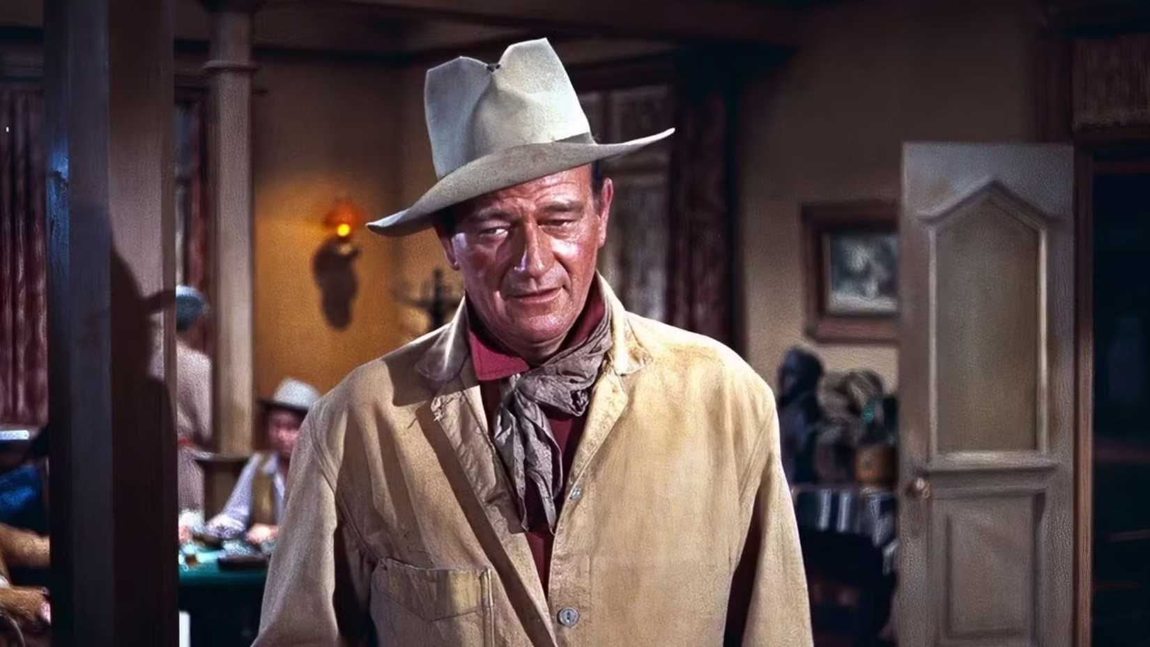 John Wayne como John Chance em Rio Bravo, olhando para baixo.