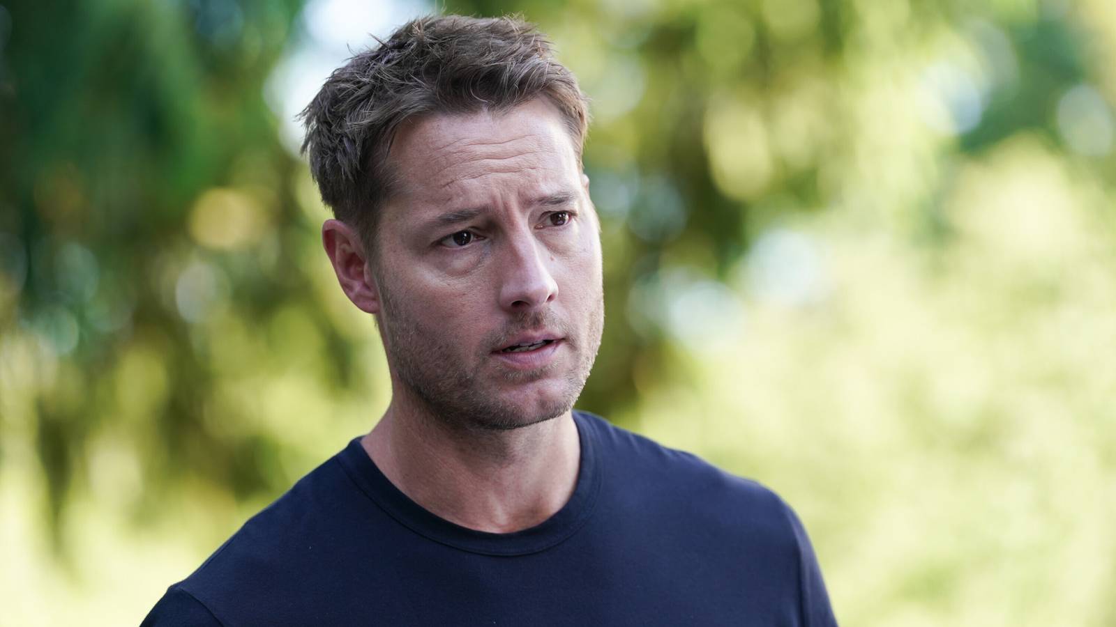 Justin Hartley as Colter, talking to someone, in Tracker season 3