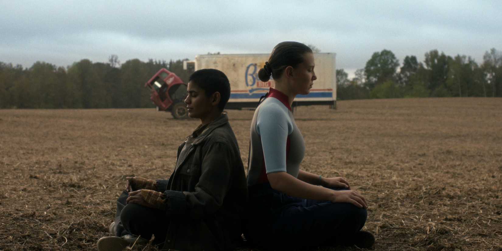 Kali and Eleven sitting back to back in Stranger Things season 5