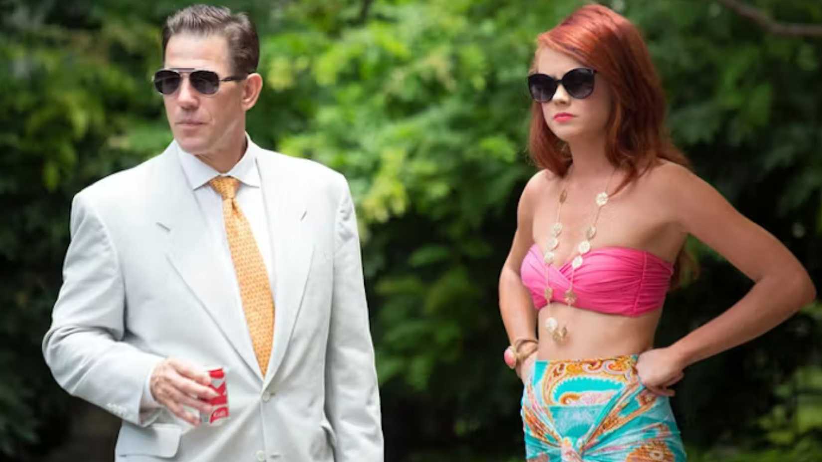 Kathryn standing next to Thomas a pool party on Southern Charm