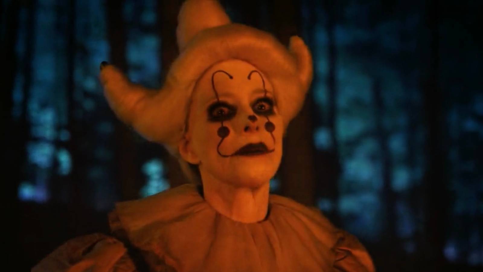 Madeleine Stowe's Ingrid dressed as Periwinkle in the woods from It Welcome to Derry episode 7
