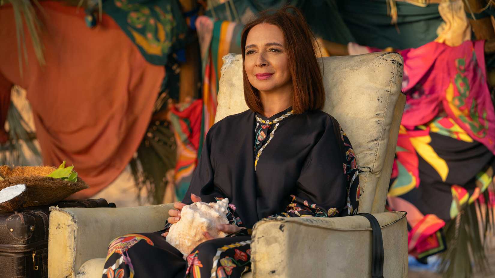 Maya Rudolph sitting and smiling in Apple TV's Loot