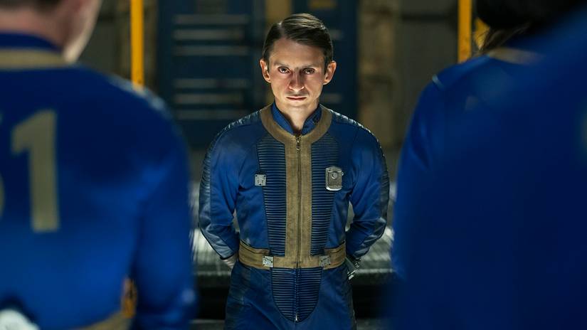 Moisés Arias' Norm looking intensely at other Vault Dwellers in Fallout season 2