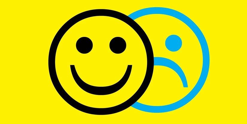 More Happy than Not's collectors edition book cover shows a frowny face behind a smiley face