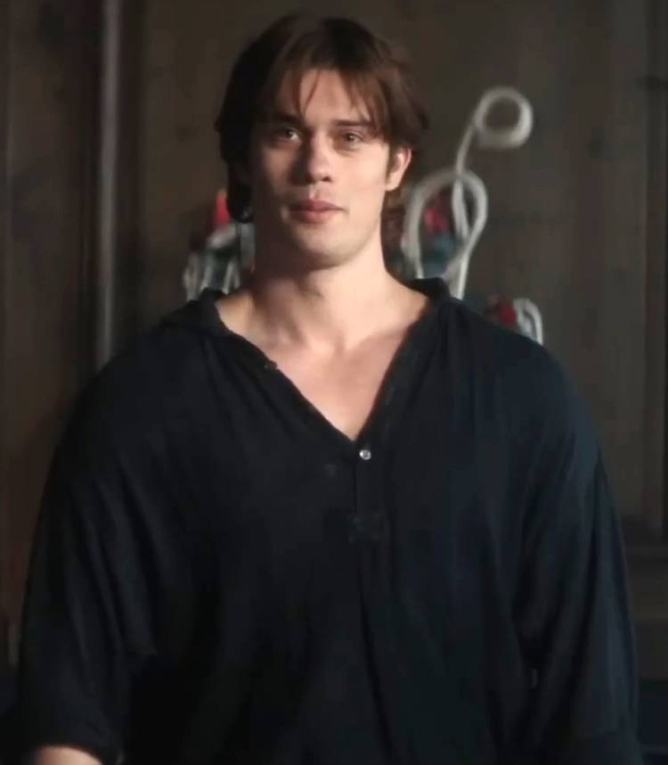 Nicholas Galitzine's Manfred smiling slightly at Cherry in 100 Nights of Hero