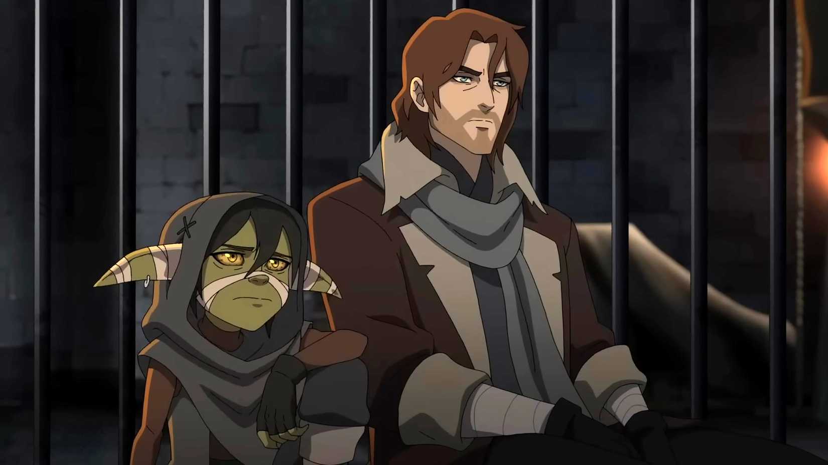 Nott looking sad and Caleb looking stoic while sitting next to each other in a cell in The Mighty Nein season 1