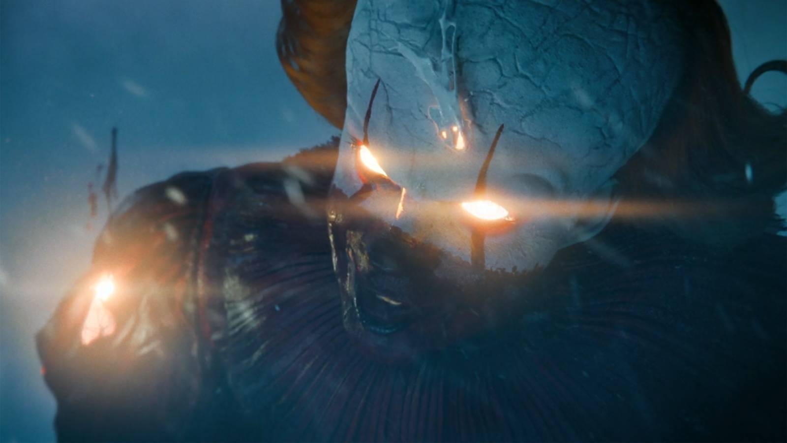 Pennywise's eyes glowing yellow and his face starting to melt in IT: Welcome to Derry Episode 8
