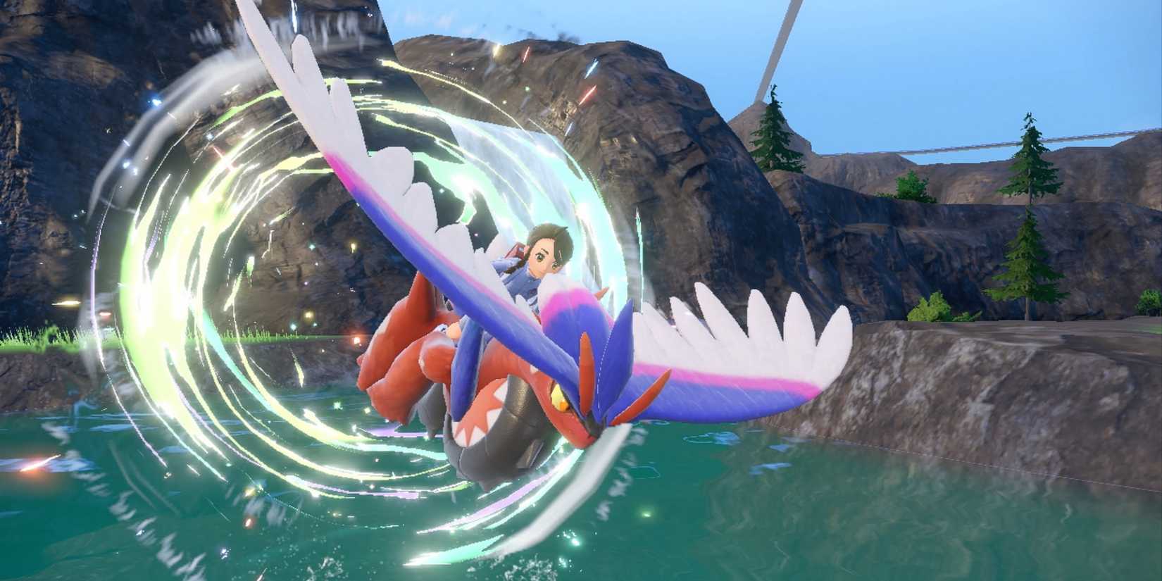 Ein Trainer reitet auf seinem fliegenden Koraidon in den Pokémon Scharlachrot und Violett.