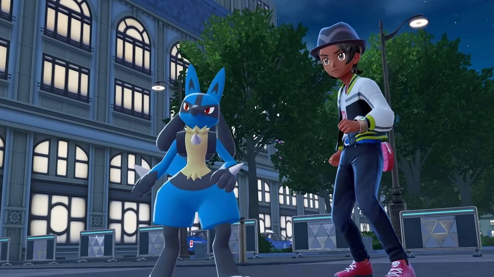 Un allenatore si trova accanto al suo Lucario in Pokémon Legends Z-A
