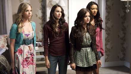 Ashley Benson as Hanna, Troian Bellisario as Spencer, Lucy Hale as Aria, and Shay Mitchell as Emily looking concerned in Pretty Little Liars.