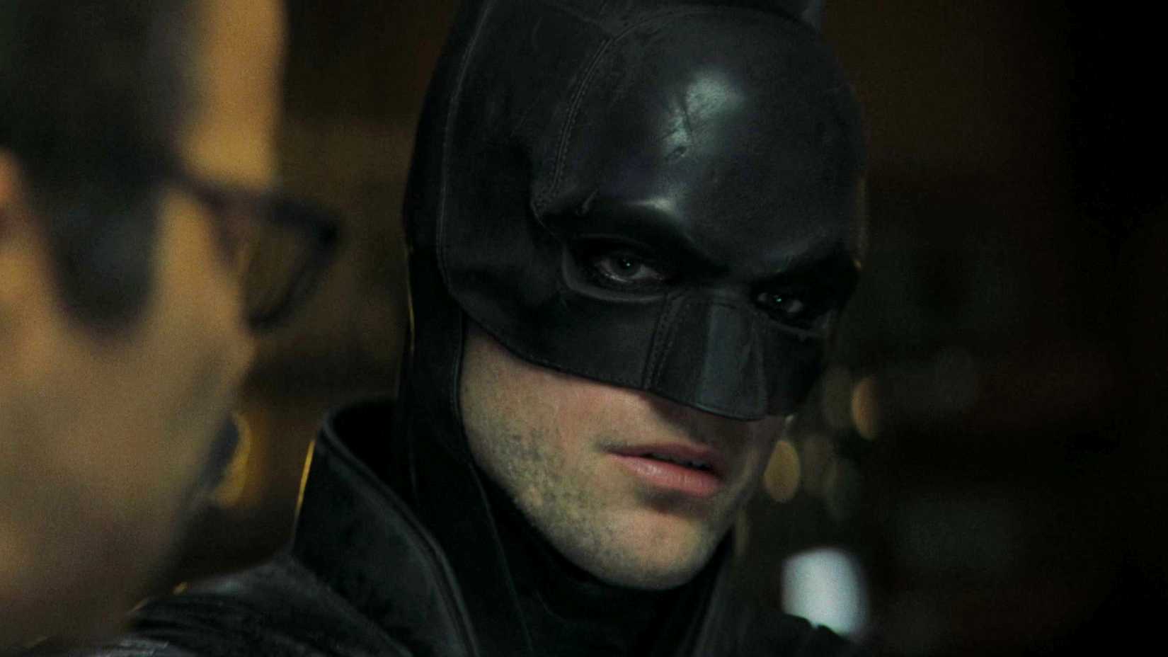 Robert Pattinson's Batman with Jeffrey Wright's Jim Gordon investigating in The Batman