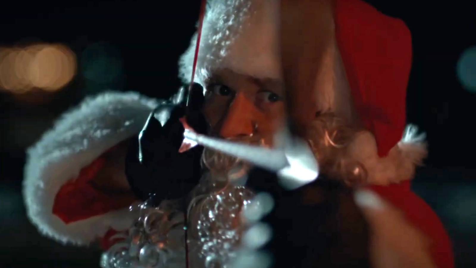 Rohan Campbell's Billy aiming a bow and arrow in his Santa suit in Silent Night, Deadly Night