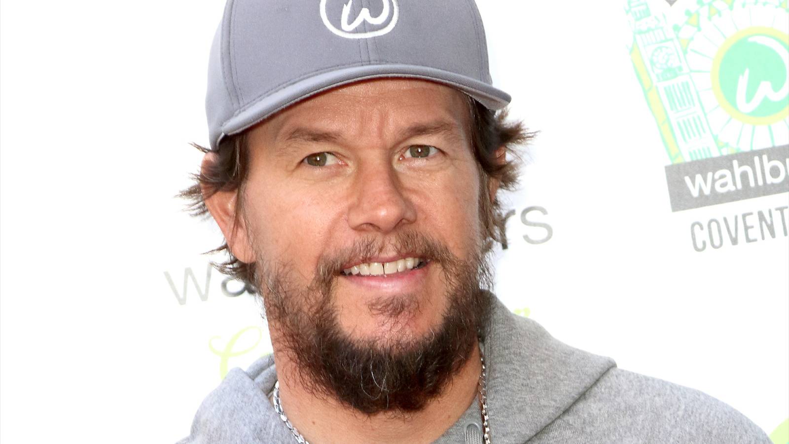 Mark Wahlberg looks forward with a slight smile during an event