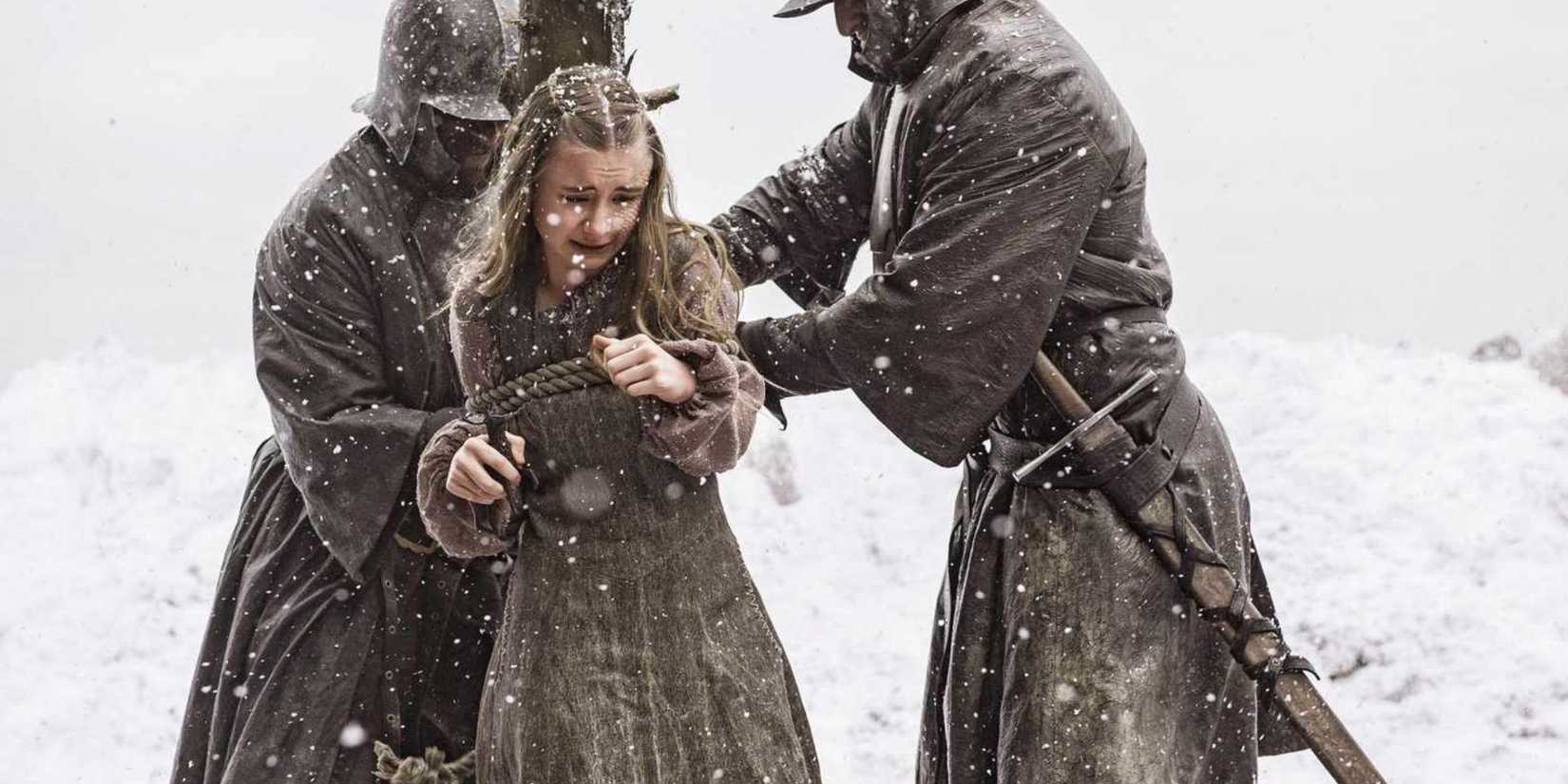 Shireen Baratheon being tied to a stake in Game of Thrones
