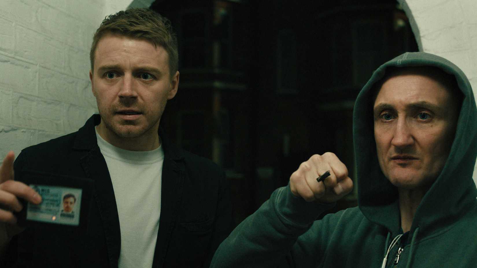 River and Coe Look Frightened At Something Off Screen in Slow Horses