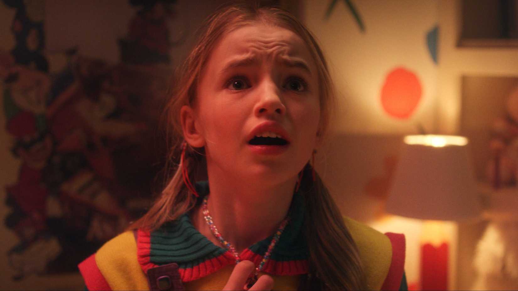 Holly (Nell Fisher) looking up scared in Stranger Things season 5.