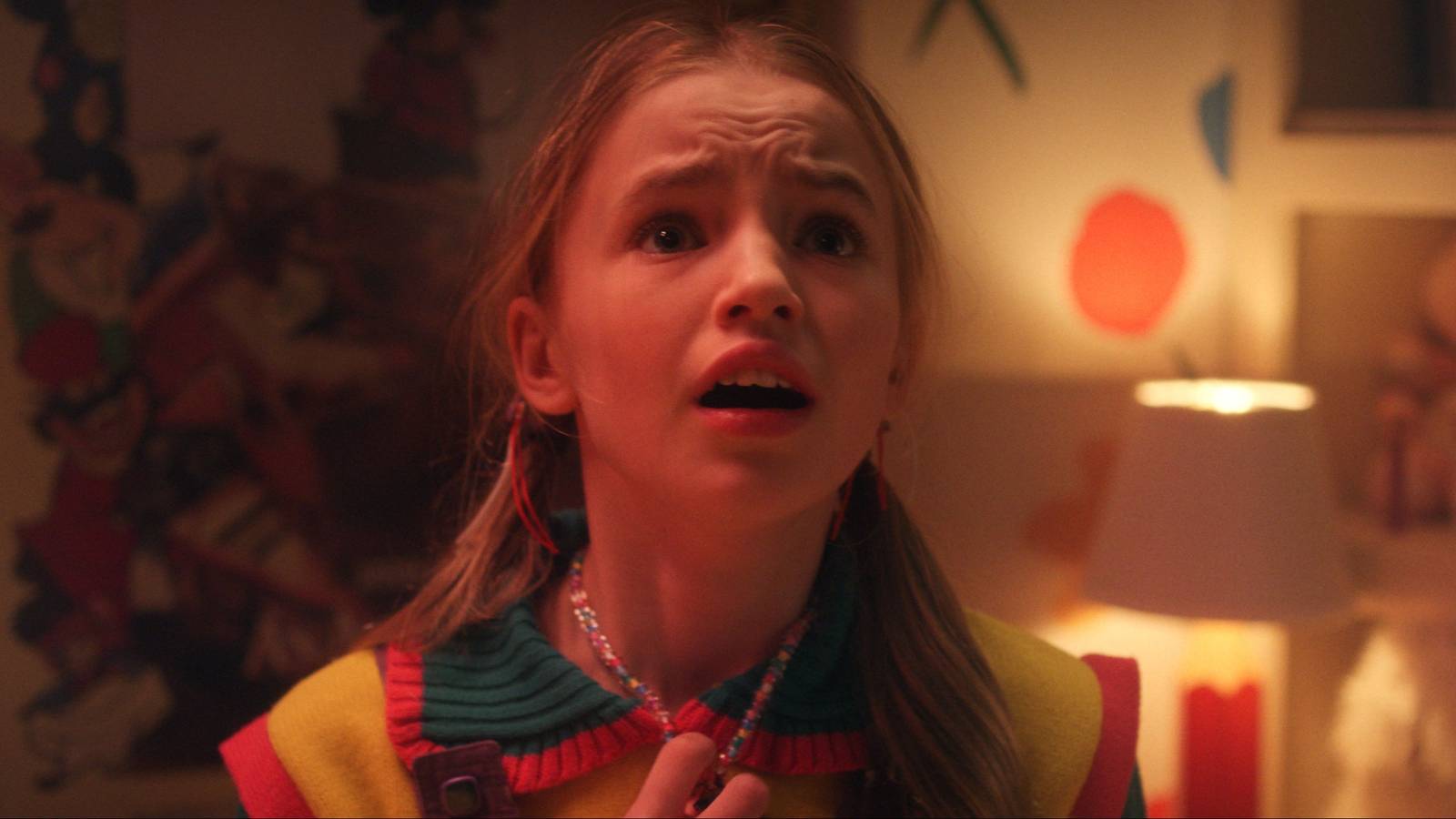 Holly (Nell Fisher) looking up scared in Stranger Things season 5.