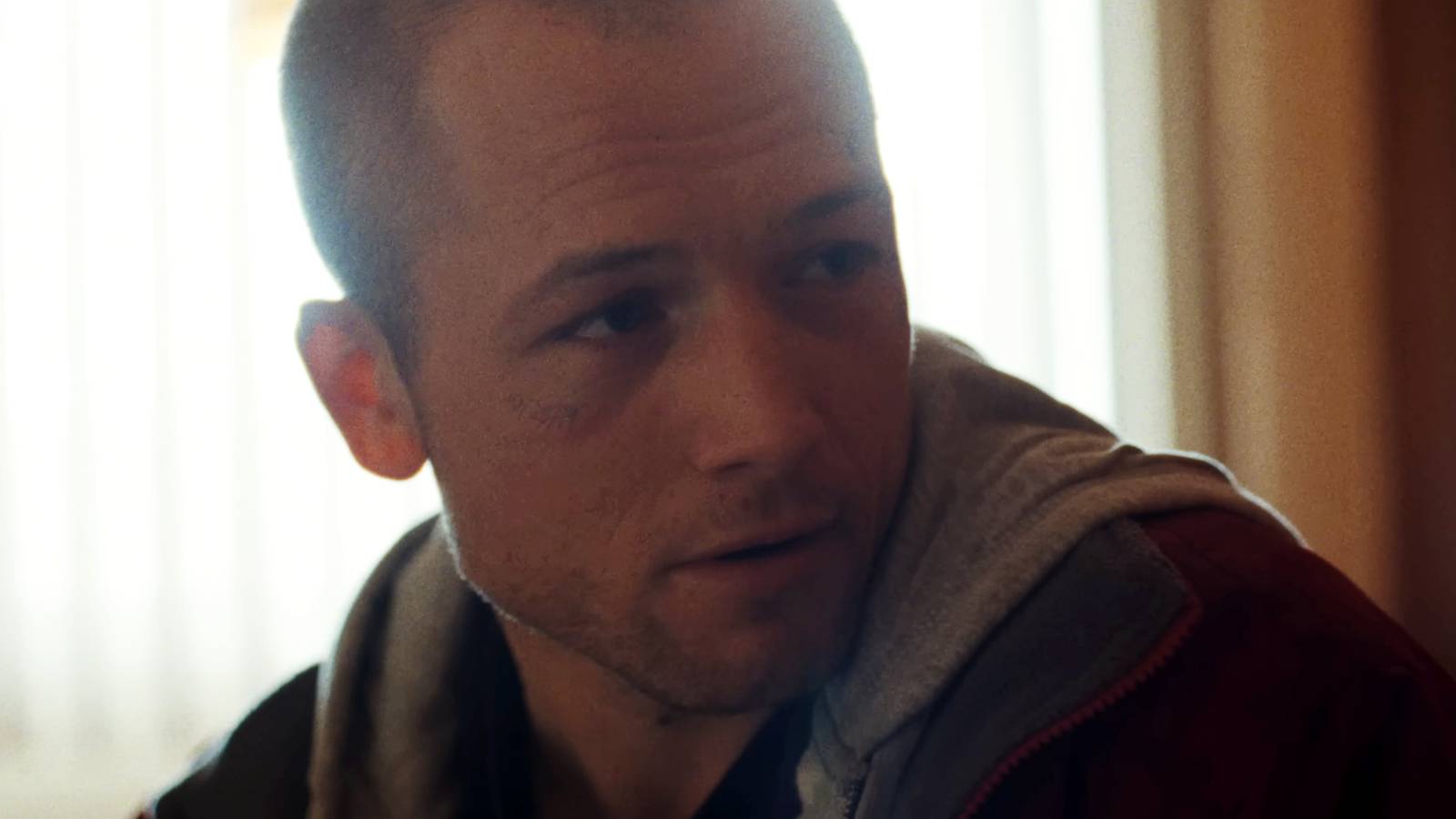 Taron Egerton looking to the side in She Rides Shotgun