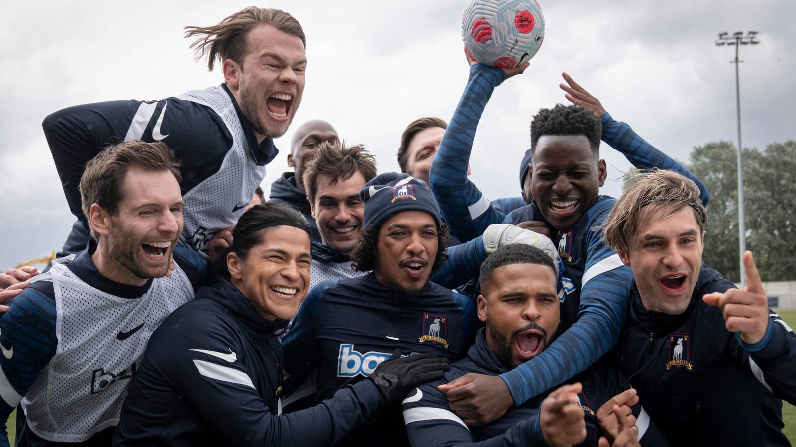 The AFC Richmond Team Huddles Excitedly in Ted Lasso